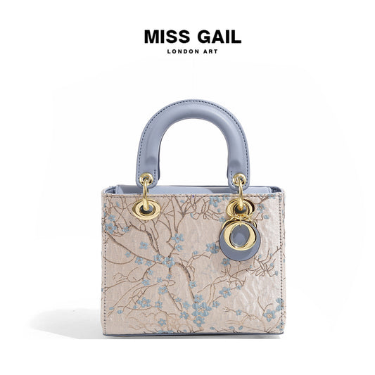 A embroidered shoulder bag messenger bag