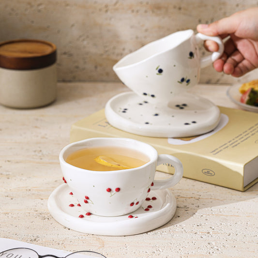 A Embossed Ceramic Coffee Cup and Saucer Set