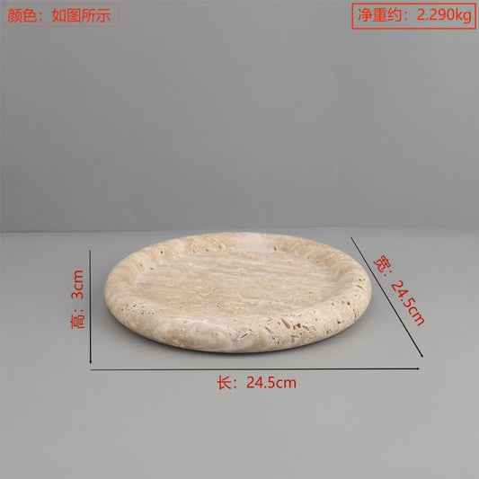 A geometric round travertine marble tray ornament