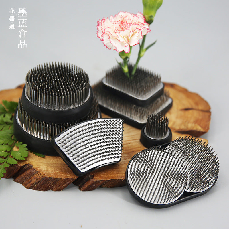 A Stainless Steel Flower Arrangement Base Needle Tool