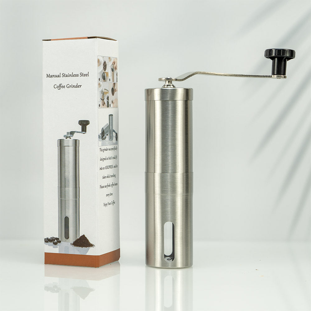 A stainless steel hand coffee grinder