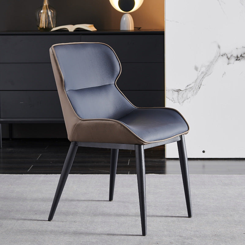 A wrought iron leather chair seat