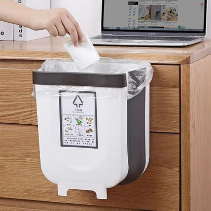 A kitchen trash can hanging type foldable