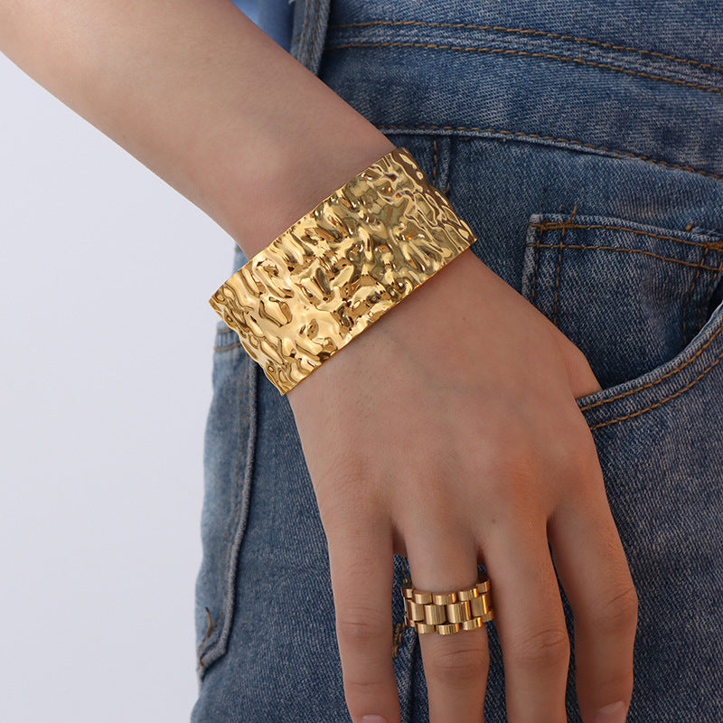 A European and American style titanium steel adjustable opening bracelet natural heavy industry beating pattern texture exaggerated personality design explosion