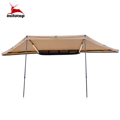 A double pole scalloped roof tent with lights