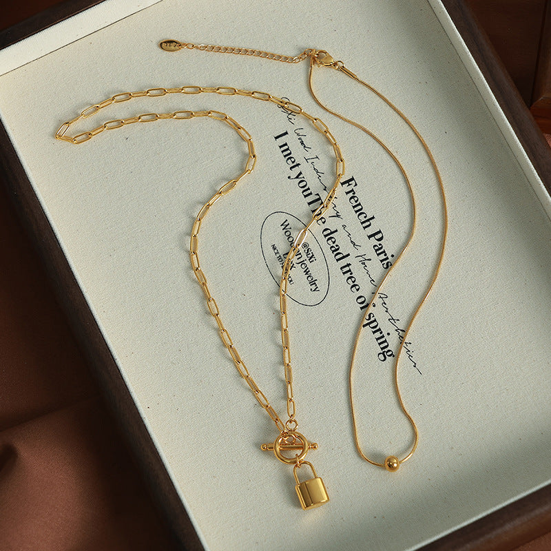 A European and American personality trend OT buckle two wear lock head steel ball pendant collarbone chain double stack wear necklace titanium steel jewelry