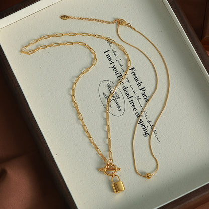 A European and American personality trend OT buckle two wear lock head steel ball pendant collarbone chain double stack wear necklace titanium steel jewelry