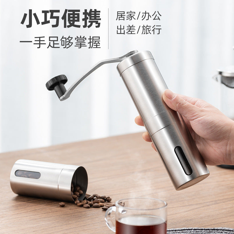 A stainless steel hand coffee grinder