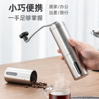 A stainless steel hand coffee grinder
