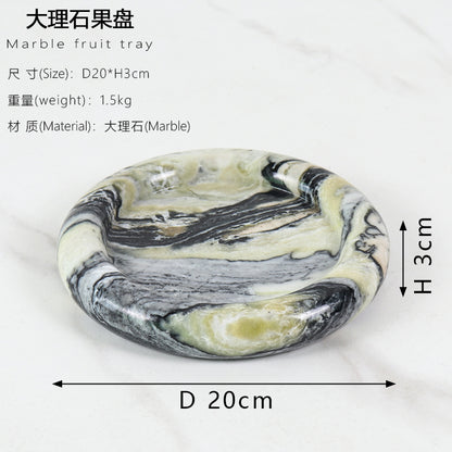 A natural yellow travertine round plate