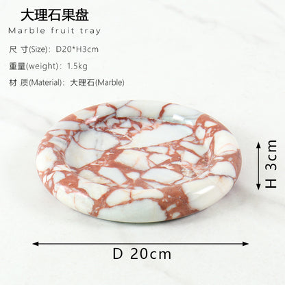 A natural yellow travertine round plate