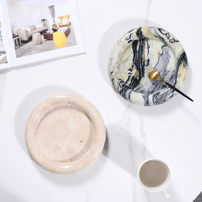 A natural yellow travertine round plate