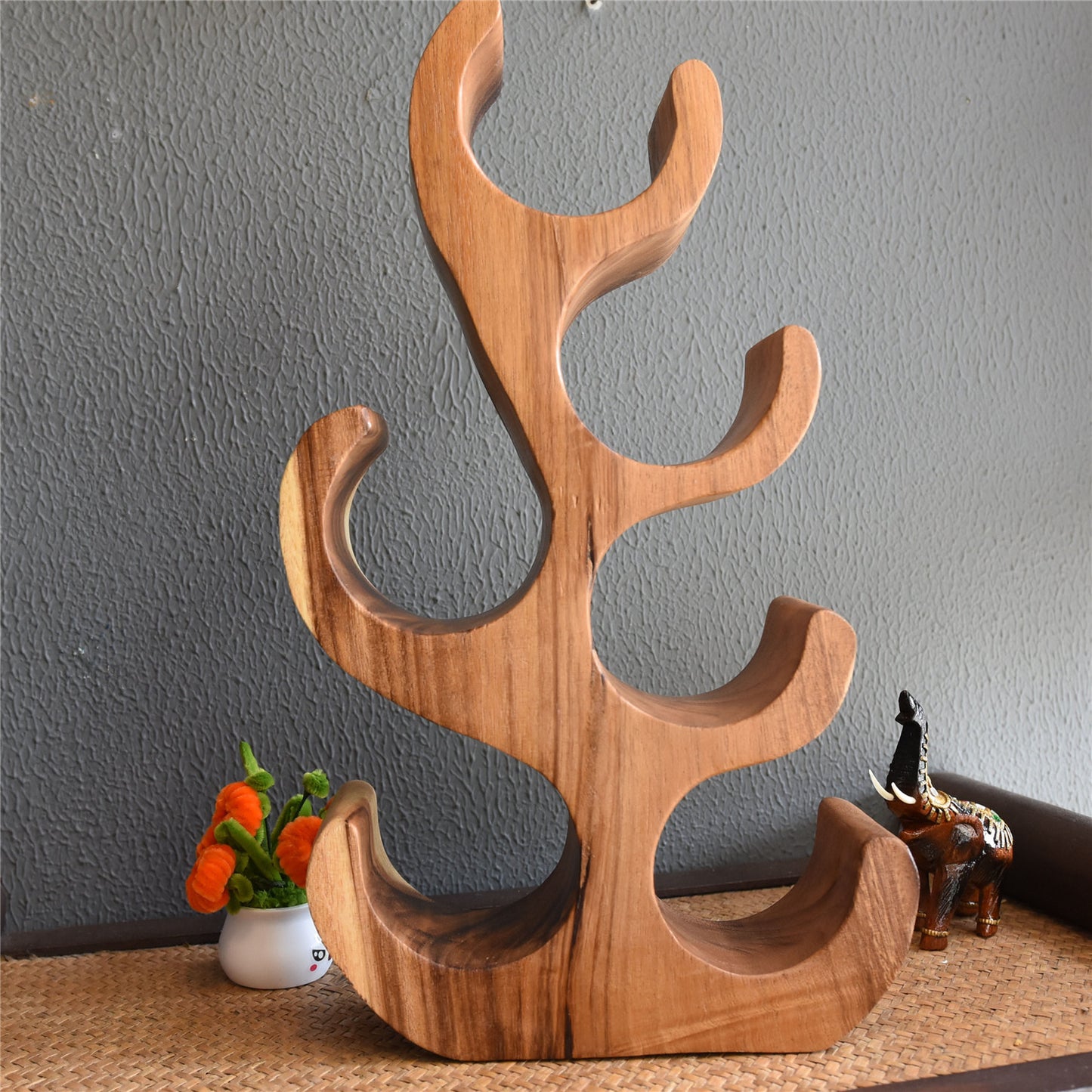 A teak wine rack ornament