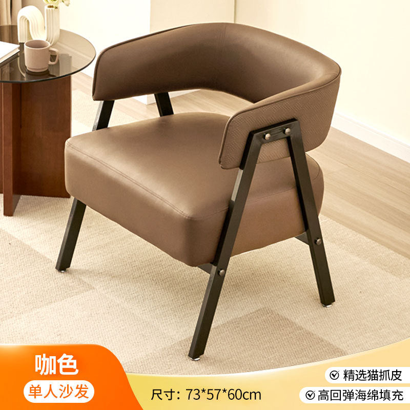 A single cat scratching casual, sofa chair
