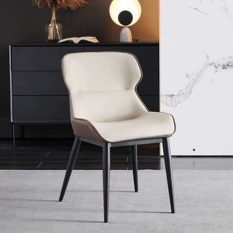 A wrought iron leather chair seat