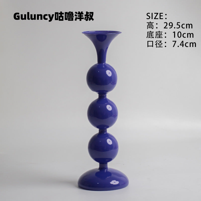 A vintage French Roman column glass candle holder