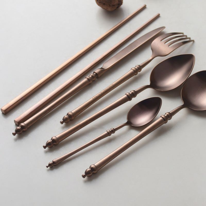A stainless steel knife and fork set