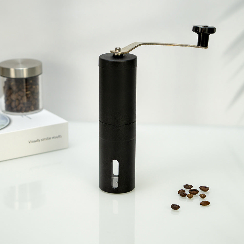 A stainless steel hand coffee grinder