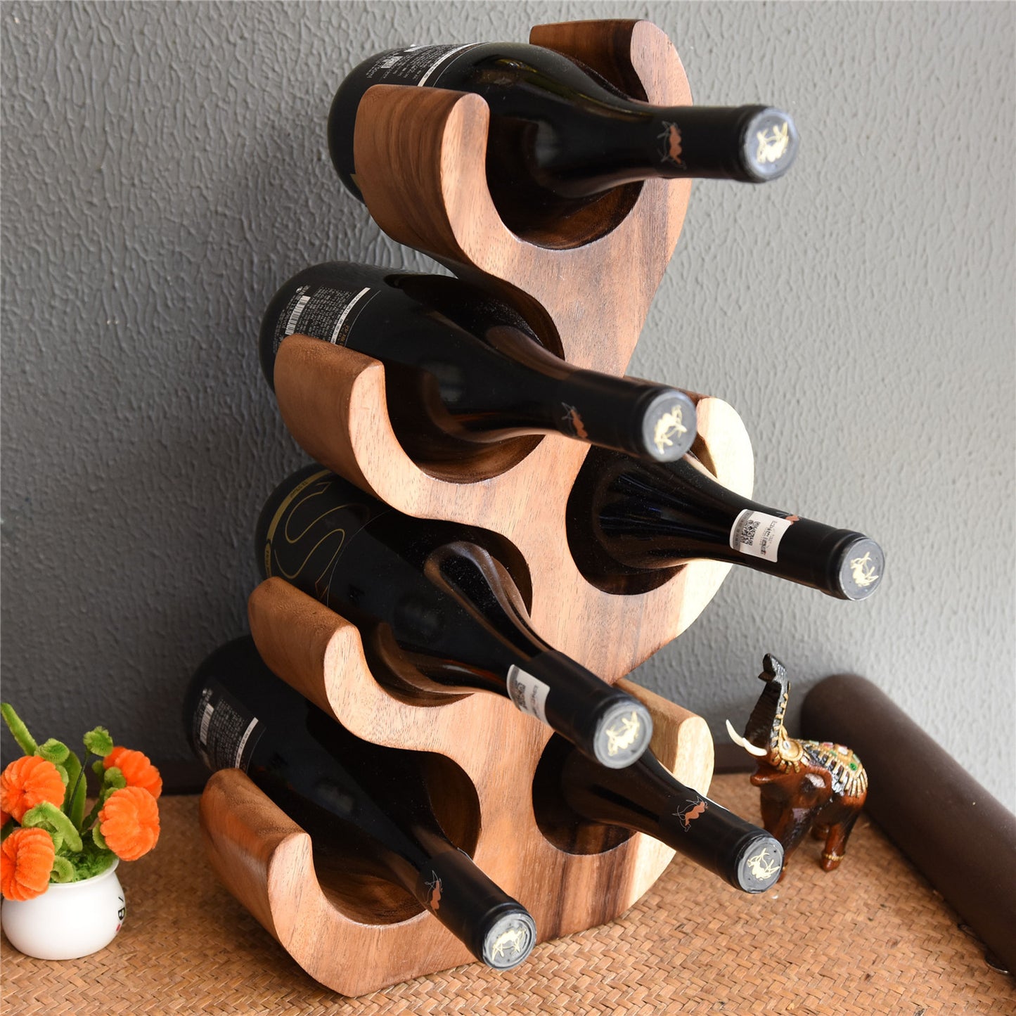 A teak wine rack ornament