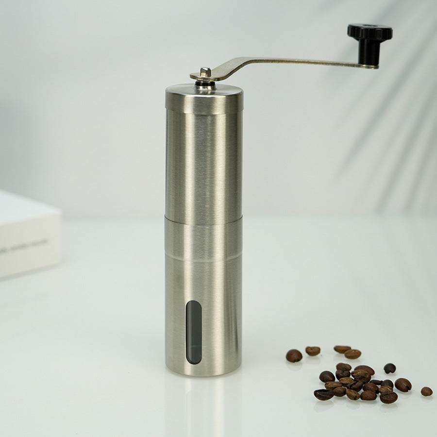 A stainless steel hand coffee grinder
