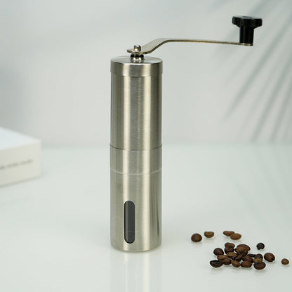 A stainless steel hand coffee grinder