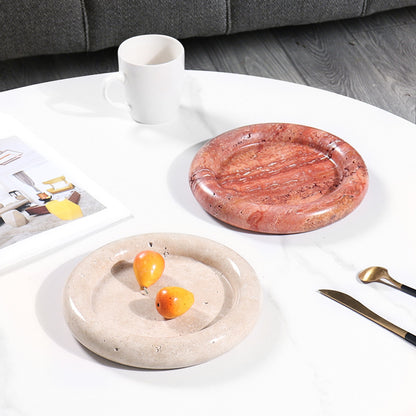 A natural yellow travertine round plate