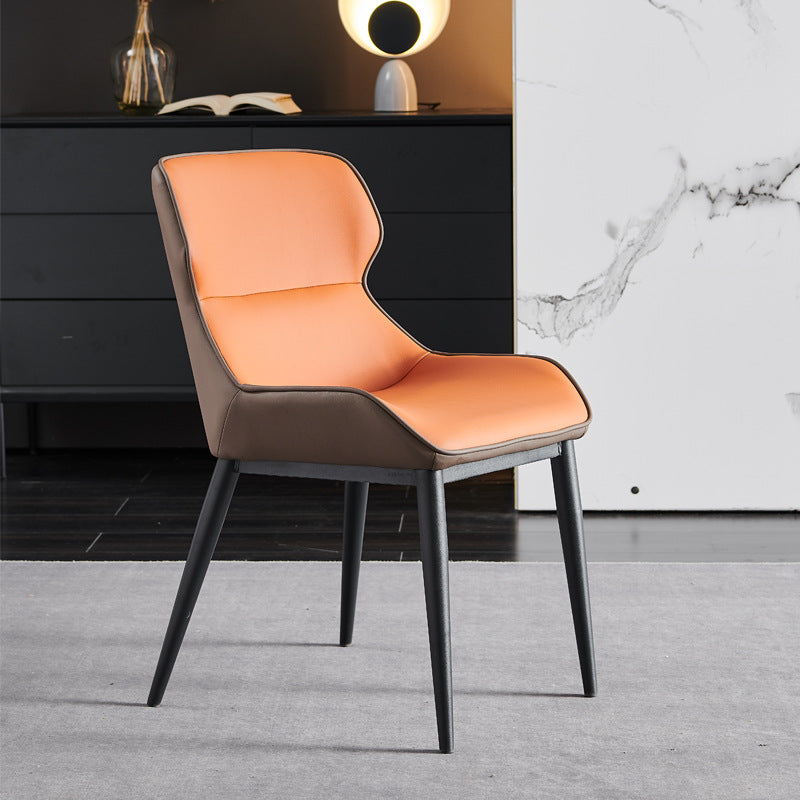 A wrought iron leather chair seat