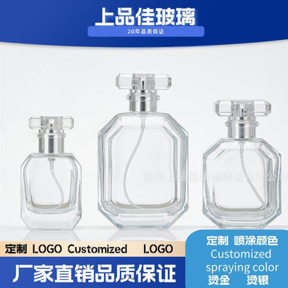 A spray bottle glass perfume bottle