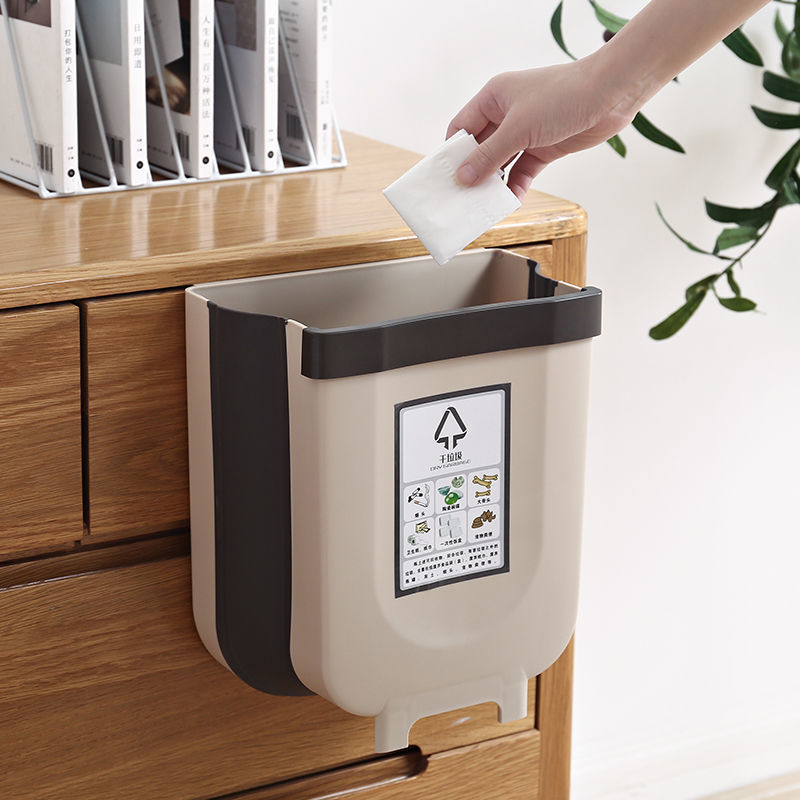 A kitchen trash can hanging type foldable