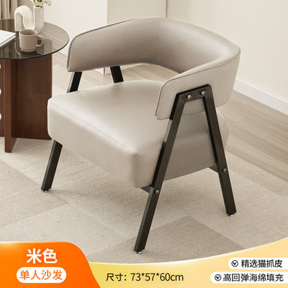 A single cat scratching casual, sofa chair