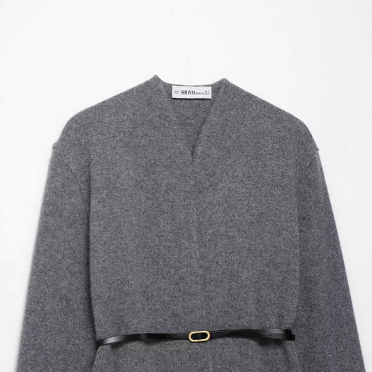 A knitted cardigan sweater jacket