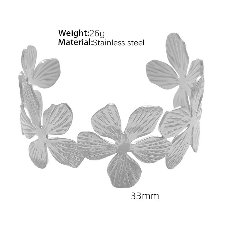 A European and American style titanium steel adjustable opening bracelet natural heavy industry beating pattern texture exaggerated personality design explosion