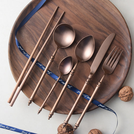 A stainless steel knife and fork set