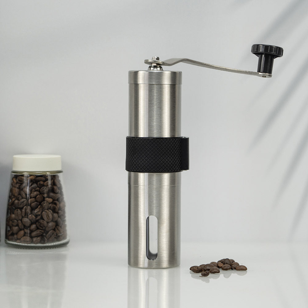 A stainless steel hand coffee grinder