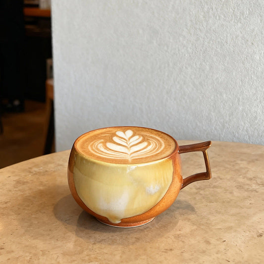 A creative upturned ear big belly coffee cup