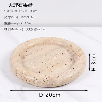 A natural yellow travertine round plate