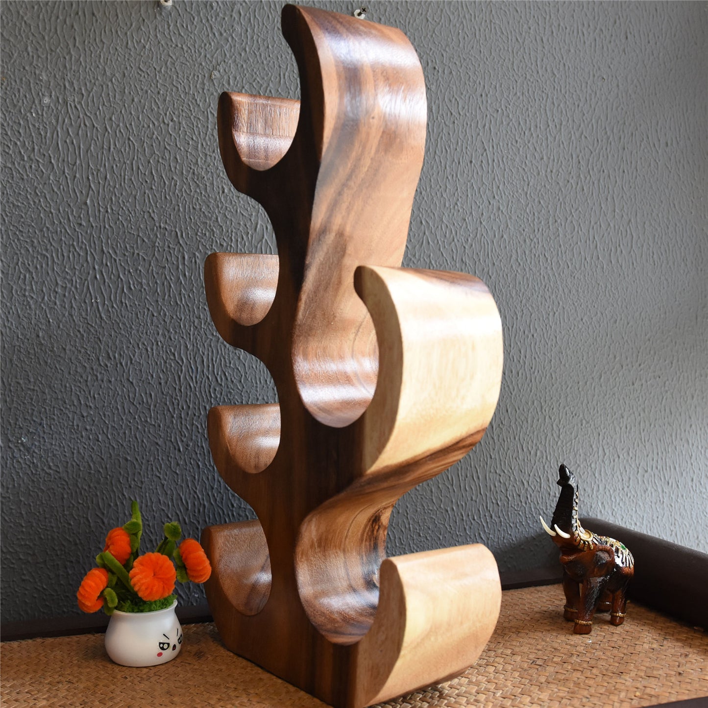 A teak wine rack ornament