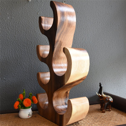 A teak wine rack ornament
