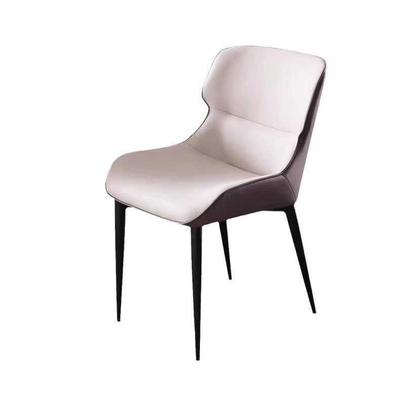 A wrought iron leather chair seat