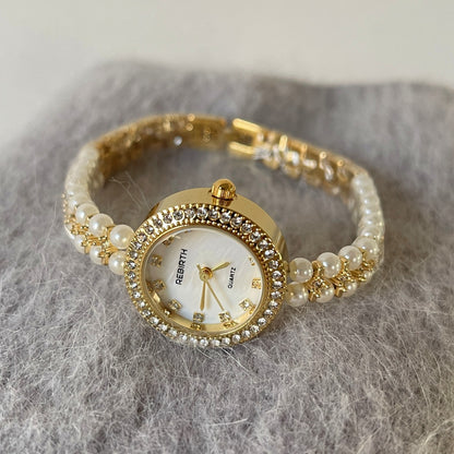 A watch women's niche light luxury retro exquisite high-end gold steel belt watch