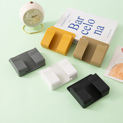 A wall-mounted mobile phone charging case storage rack