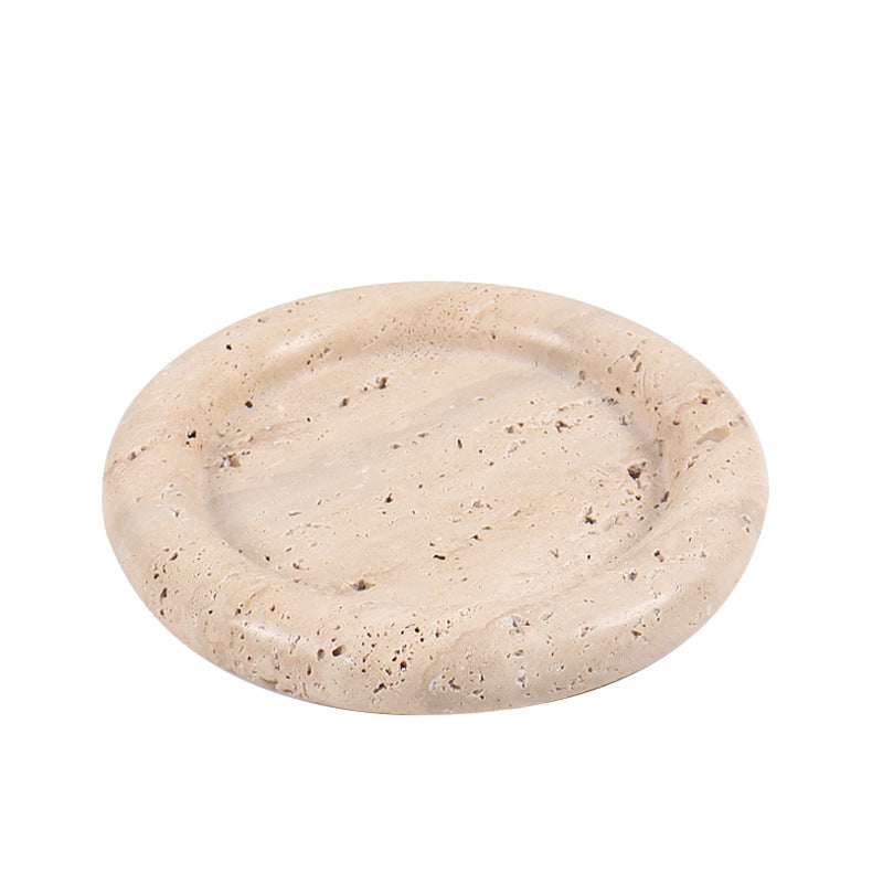 A natural yellow travertine round plate