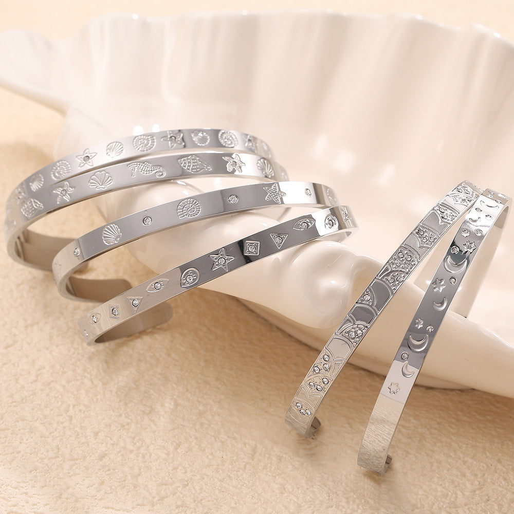 A cross-border European and American exaggerated personality versatile titanium steel inlaid zircon marine series stainless steel advanced sense opening bracelet