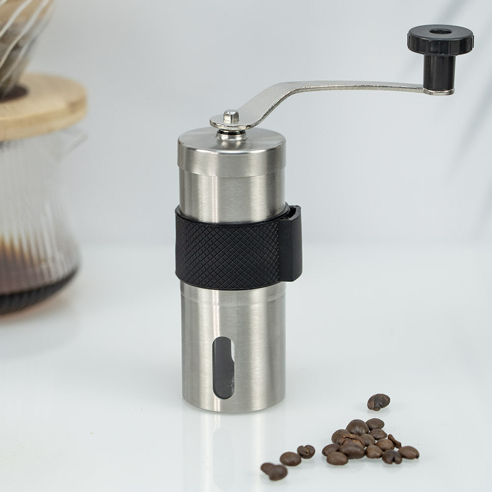 A stainless steel hand coffee grinder