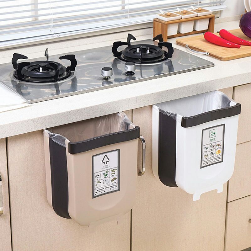 A kitchen trash can hanging type foldable