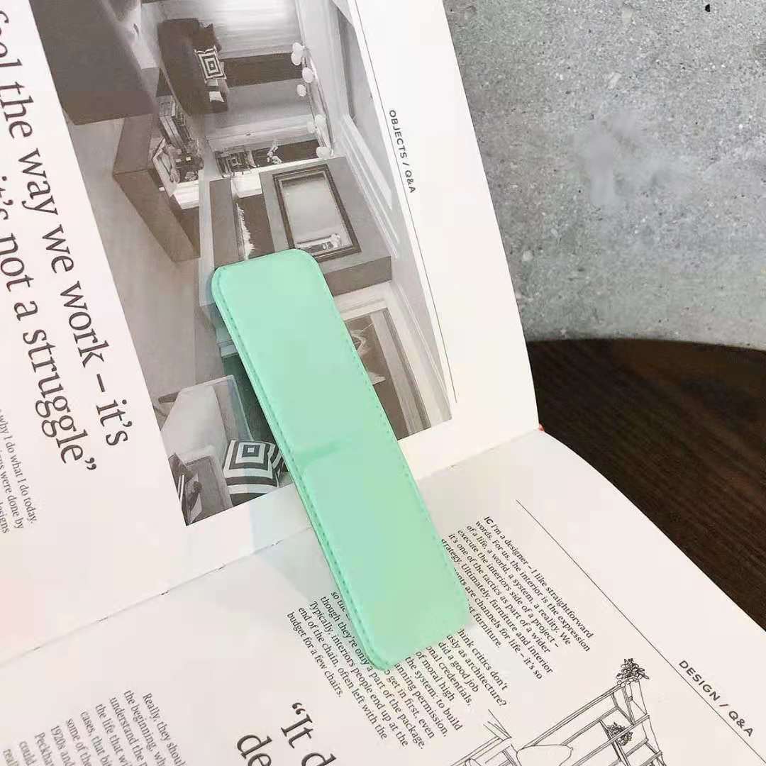 حامل هاتف محمول قابل للطي يعمل بنظام الدفع والسحب 