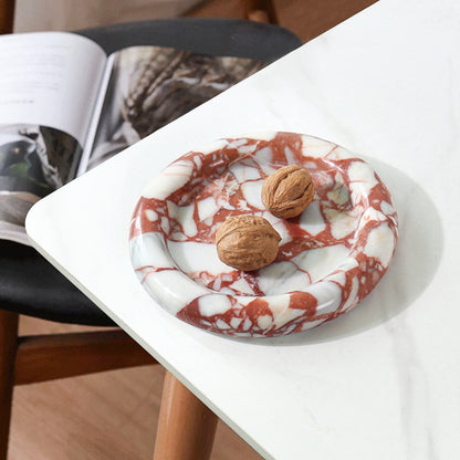 A natural yellow travertine round plate