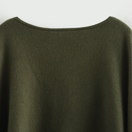 A cape knitted sweater