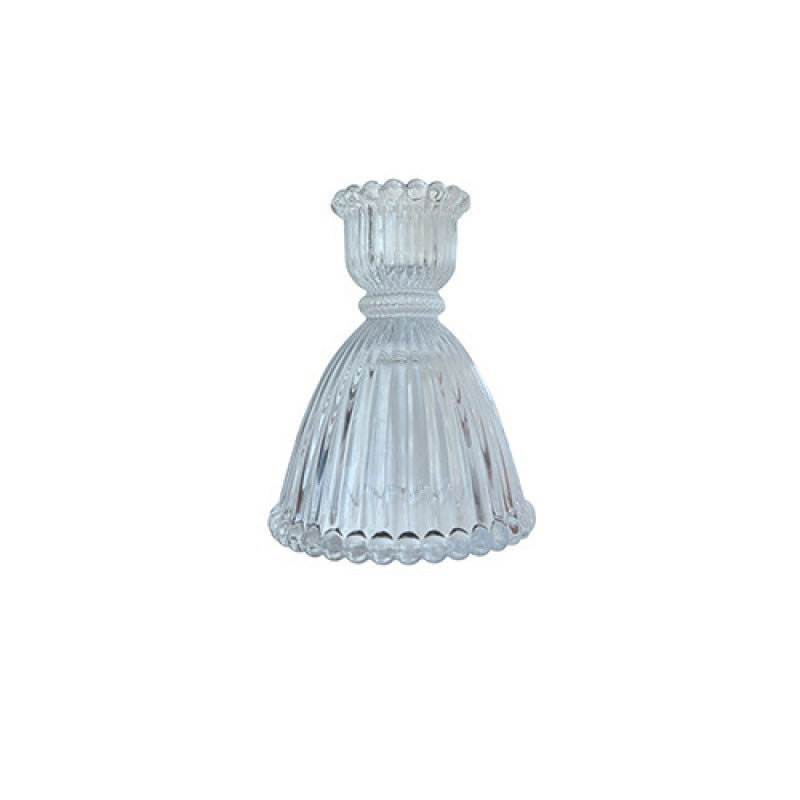 A glass candlestick ornament