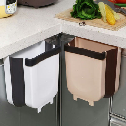 A kitchen trash can hanging type foldable